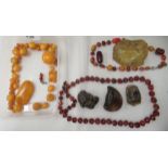 Amber coloured beads and fragments