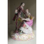 An early 20thC German porcelain group, a seated harpist with her suitor standing alongside, on a