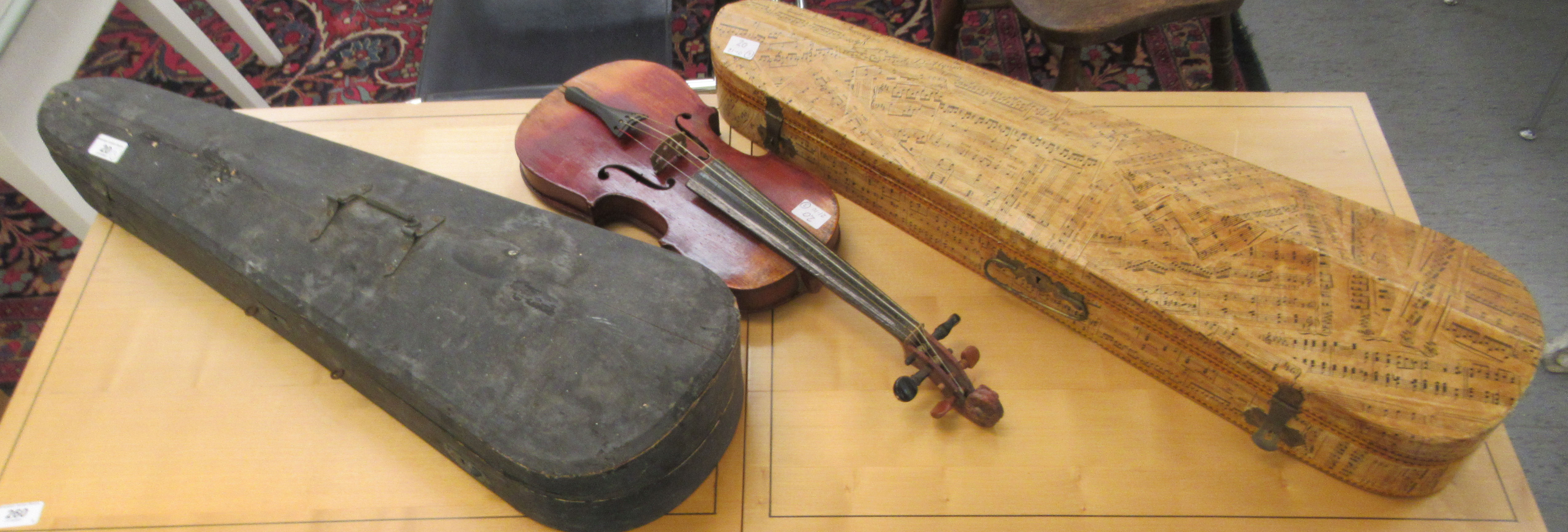 Three 19th/20thC violins, one with a one piece back  14"L; the others with two piece backs  13"