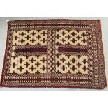 An Eastern European rug, decorated with repeating designs, on a cream and red coloured ground  43" x