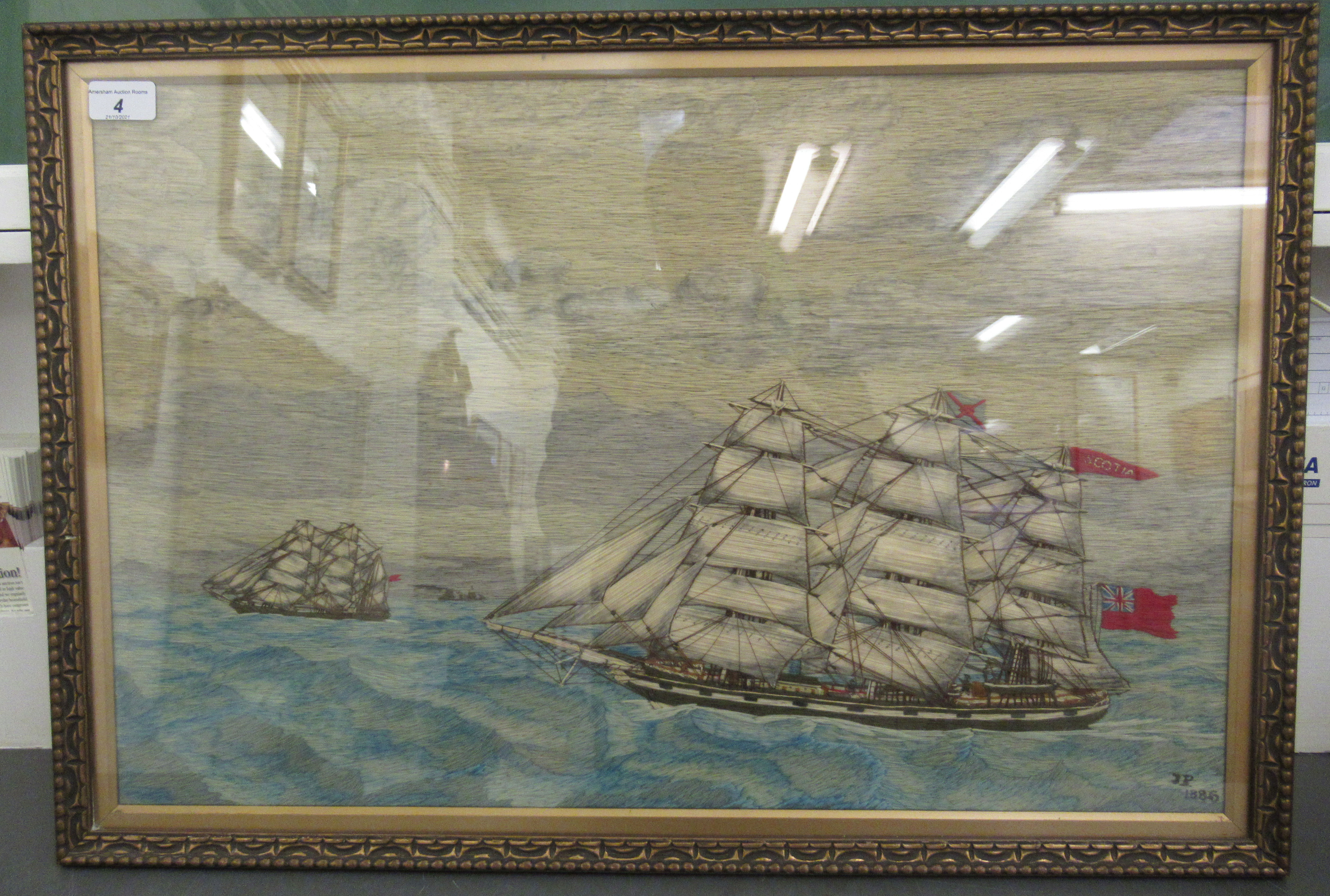 A late Victorian Merchant Navy sailor's woolwork picture, depicting a clipper, bearing three flags