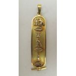 An Egyptian yellow metal pendant