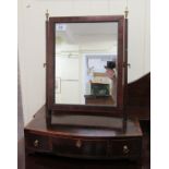 An early 19thC satinwood string inlaid and crossbanded mahogany toilet mirror, the rectangular plate