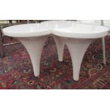 A modern white laminate trefoil side table, raised on three conical shaped legs  19.5"h  33"w