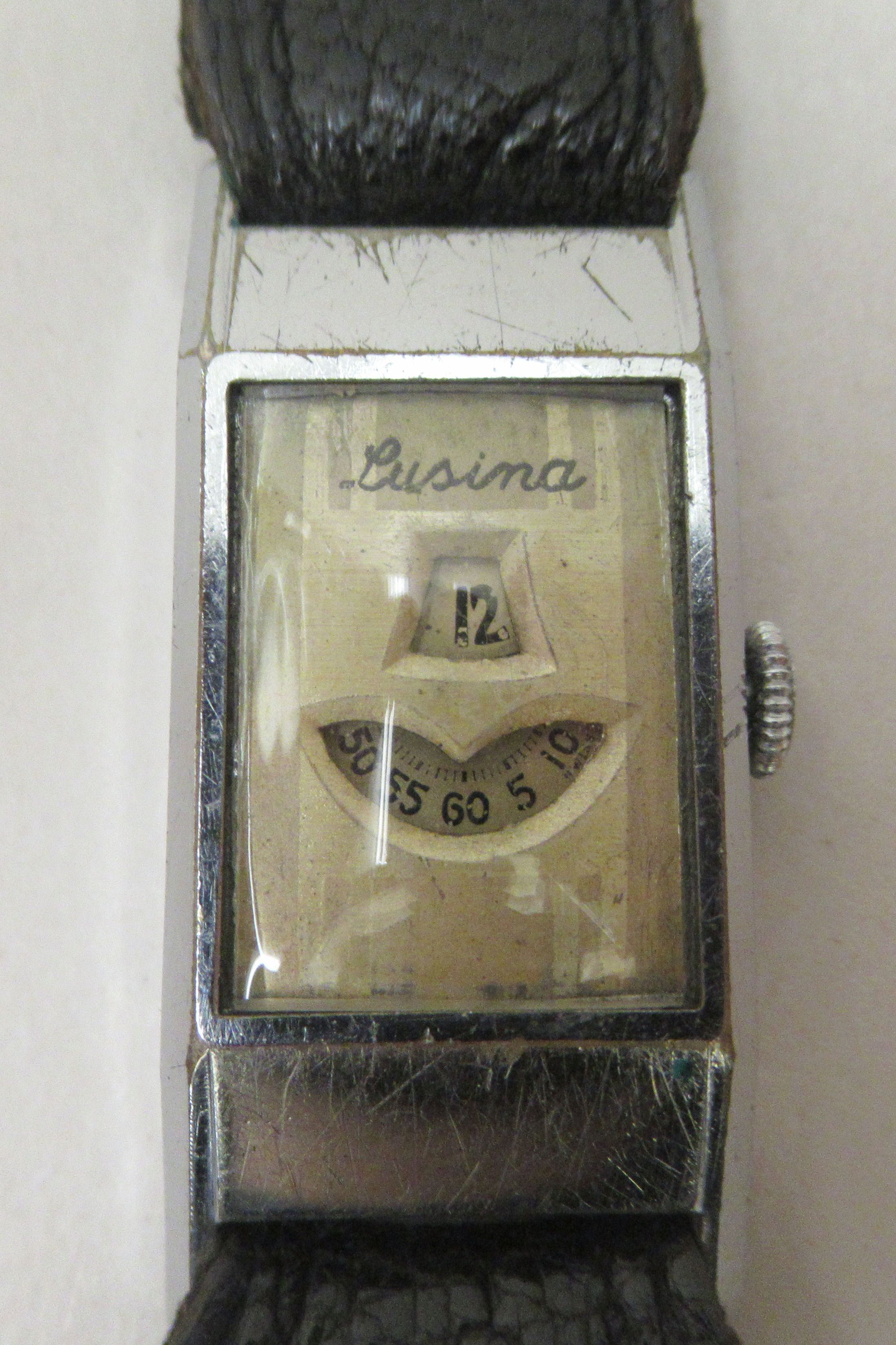 A 1930s Art Deco Lusina stainless steel cased digital watch, on a stitched black hide strap