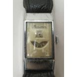 A 1930s Art Deco Lusina stainless steel cased digital watch, on a stitched black hide strap