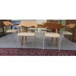 A modern light oak draw leaf dining table, raised on splayed legs  30"h  62"L; and a matching set of