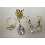 A suite of gold coloured metal jewellery, (possibly 14ct), set with aquamarine stones, viz. a