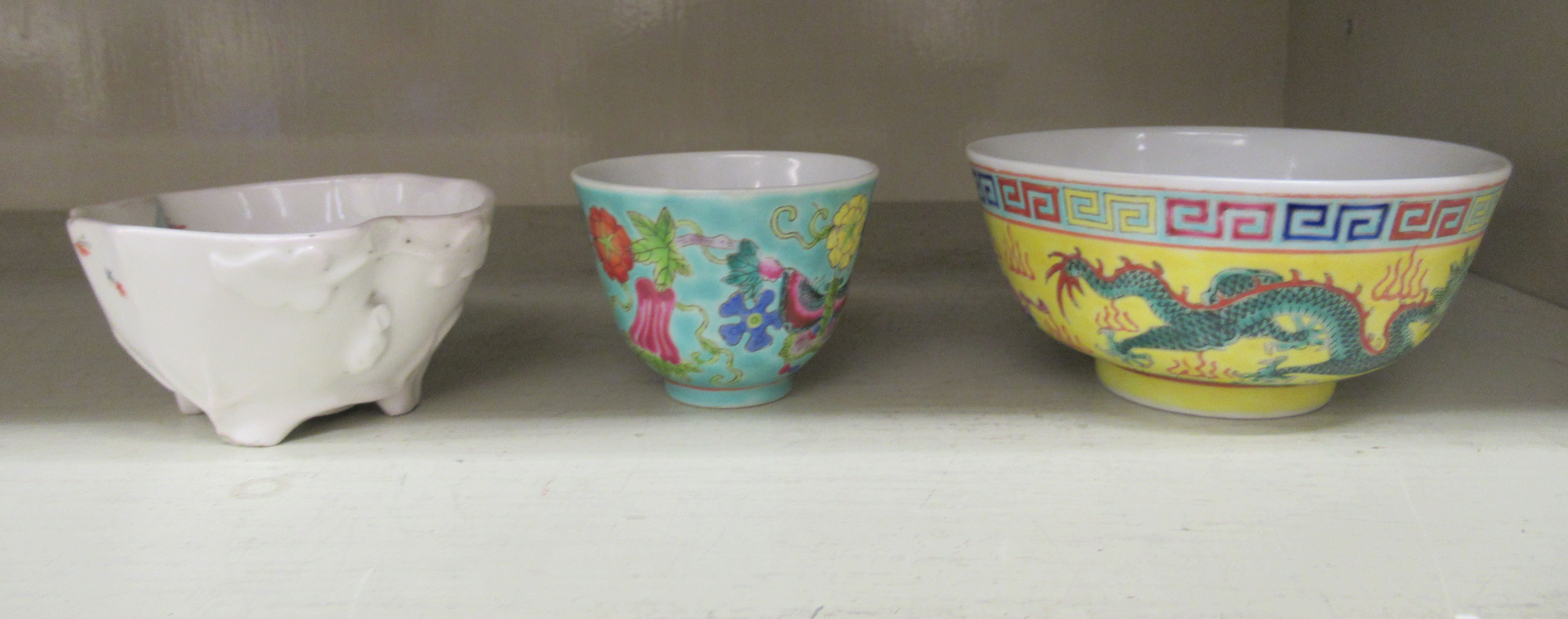 Three items of early 20thC Chinese porcelain: to include a wine bowl, decorated with birds amongst