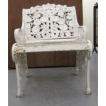 A Victorian style white painted, cast metal, single garden seat, decorated with organic forms