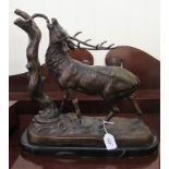 A bronze finished sculpture 'Monarch of the Glen' on a ceramic base  17"h