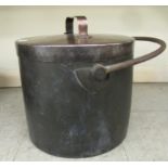 A 19thC copper cooking pot of cylindrical form with a rivetted handle to the lid and a wrought