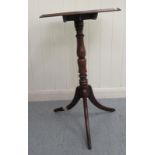 A Victorian style mahogany tip-top table, the ring turned baluster column raised on a splayed tripod