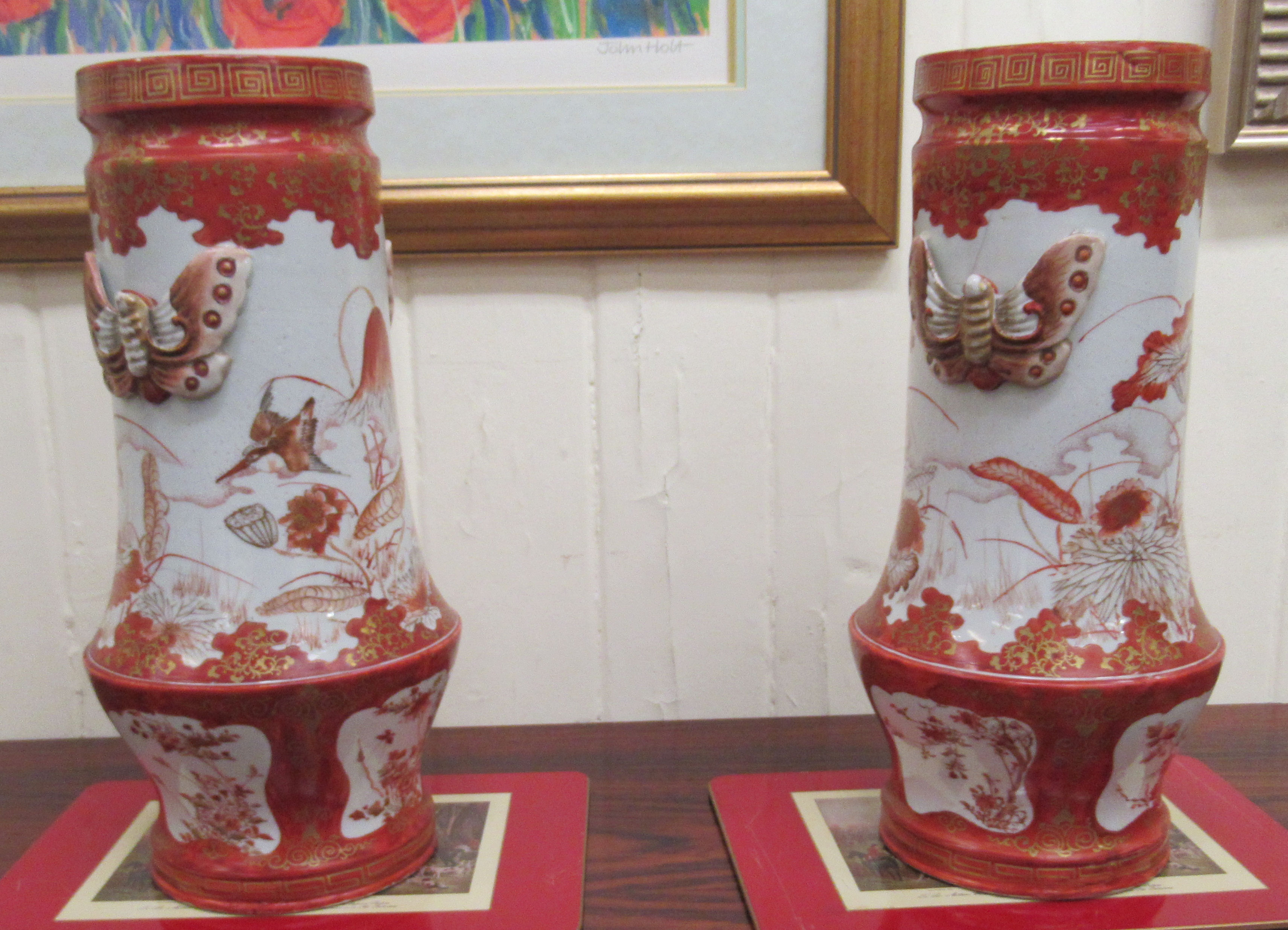 A pair of early 20thC Japanese porcelain vases, decorated in iron red and gilding with