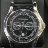 An Emporia Armani stainless steel cased Swiss made wristwatch, faced by a day/month and date dial,