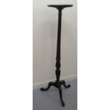 A mid 20thC reproduction of a Victorian turned and carved mahogany torchere, the tray top over a