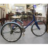 A child's mid 20thC Raleigh tricycle in blue livery with a chain drive and spoked wheels