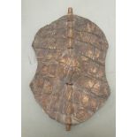 A 20thC Sudanese crocodile skin shield  13" x 9.5"