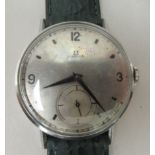 A 1940s Omega stainless steel cased wristwatch, faced by an Arabic and baton dial, incorporating