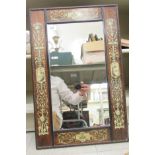 A classically inspired mirror, set in a faux inked bone inlaid rosewood finished frame  25" x 16"