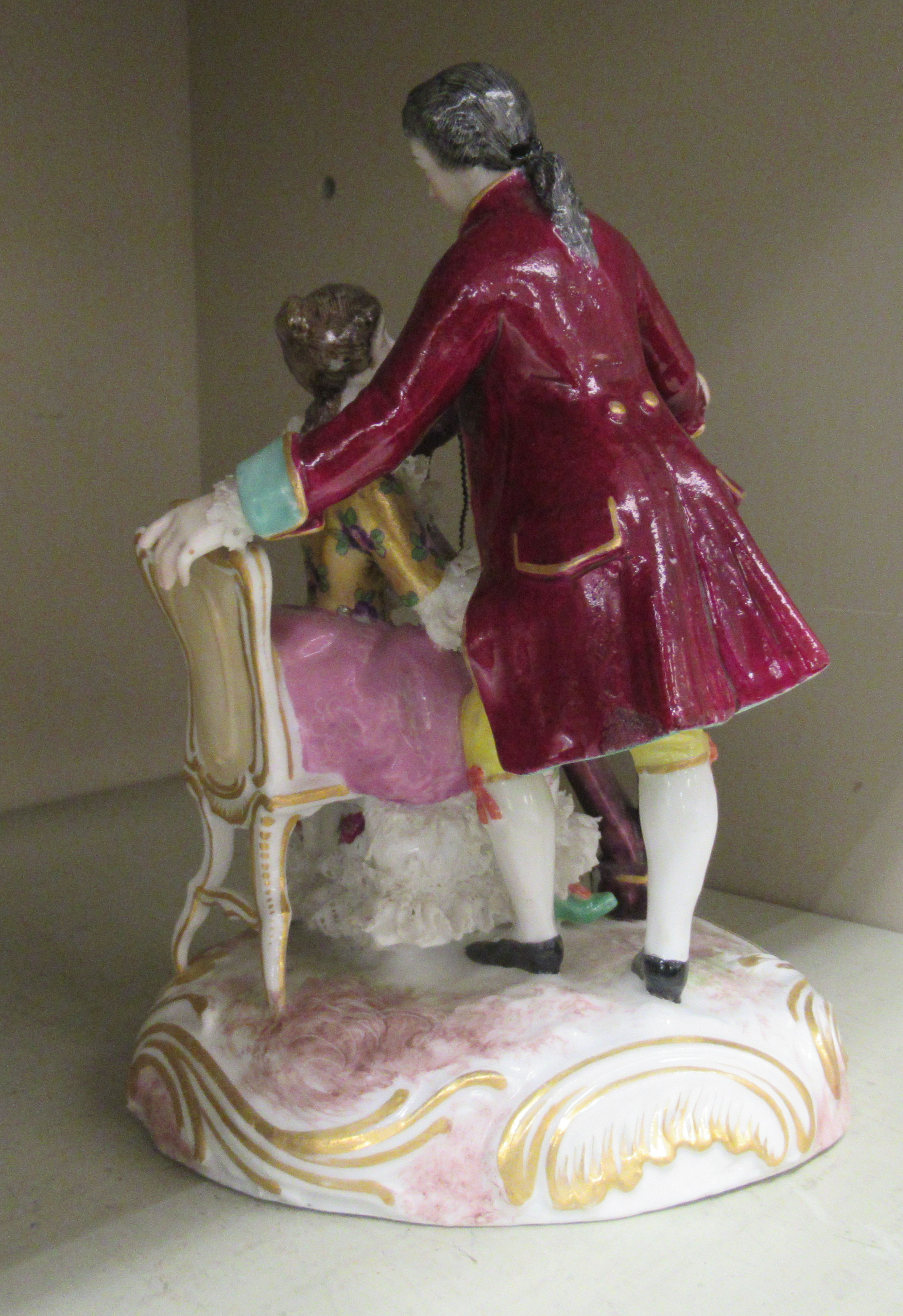 An early 20thC German porcelain group, a seated harpist with her suitor standing alongside, on a - Image 2 of 3