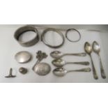 Silver items: to include bangles; and a set of five coffee spoons