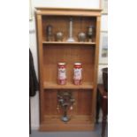 A modern waxed pine, deep open front bookcase with one fixed and four height adjustable shelves,