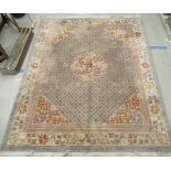 A Chinese washed woollen carpet, decorated with traditional designs, in pastel colours  138" x 160"