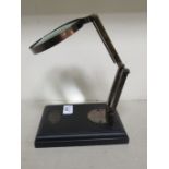 A Kelvin & Hughes desk-top adjustable magnifying glass