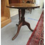 A 19thC country made pedestal table, the planked tip-top over a baluster column, raised on a