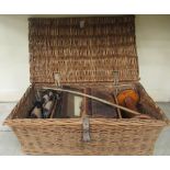 A woven cane hamper  26"w; and a miscellaneous contents: to include turned wooden spools  10"h