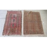 Two late 19th/early 20thC North African design rugs, on multi-coloured grounds  34" x 50" and 29"