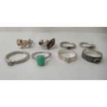 Eight variously set silver and white metal rings