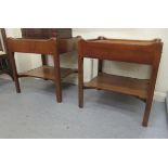 A pair of 20thC mahogany two tier single drawer lamp tables, each with the shallow galleried top,