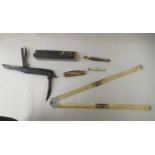 A mixed lot: to include an ivory folding ruler; a US made, hand-held brass level; and three