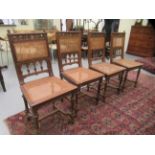 A set of four early 20thC French carved walnut framed side chairs, each having a split cane panelled
