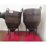 A pair of galvanised metal tapered vases with twin handles, on cast iron stands  9"h overall