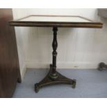 A Regency and later brass inlaid mahogany pedestal table, the top set with chessboard pattern and