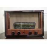 A 1950s G Marconi walnut cased wireless, model no.T28AT  13"h