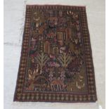 A Baluchistan rug, decorated with repeating stylised designs, on a multi-coloured ground  36" x 47"