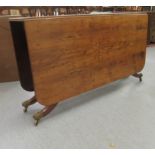 A modern reproduction of a late 18thC yewwood veneered Sutherland design, gateleg dining table,