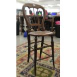 A child's late Victorian satin mahogany framed triple spindled, balloon back side chair with a woven