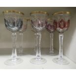 A set of six Bohemian style, variously coloured hock glasses