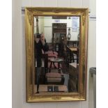 A modern mirror, the bevelled plate set in a gilt frame  28" x 19"