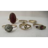 Six Edwardian and later 9ct gold rings, set with coloured stones