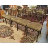 A set of five early 20thC Continental carved walnut framed side chairs, each having a waisted splat,