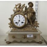 A late 19thC gilt painted spelter and onyx cased mantel clock, featuring a hunter with a gun; the