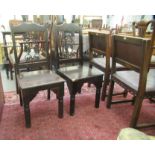 A pair of modern stained beech and pine framed side chairs, each with a fruiting vine cast iron