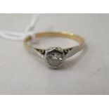 An 18ct gold single stone, diamond ring with platinum shoulders