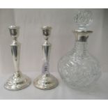 A pair of silver candlesticks, each of circular, tapered form  indistinct London marks  8"h; and a